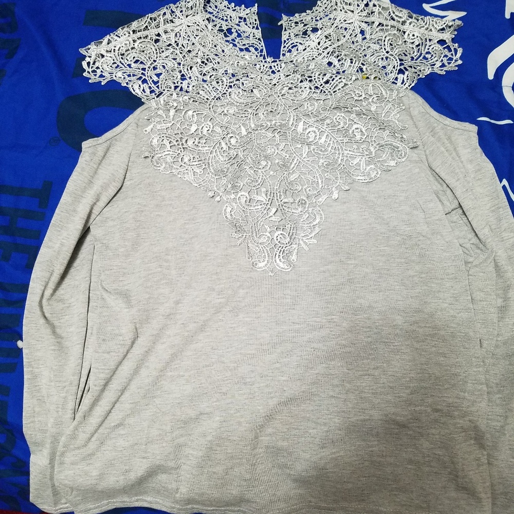 A grey shirt its brand me its a size medium